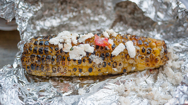 Grilled corn with cheese, chili, lime