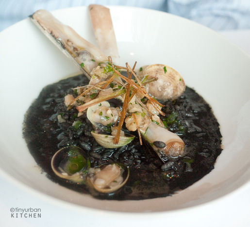 Wavy black ink risotto… many clams from Rialto