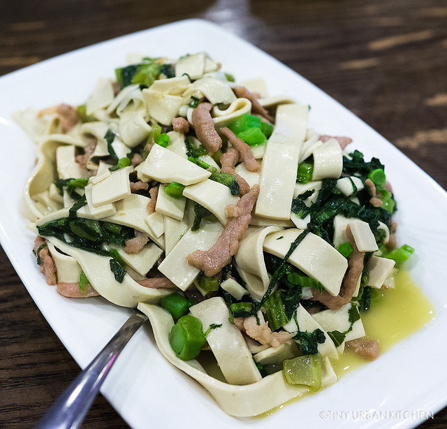 Tofu noodles, mustard greens and pork