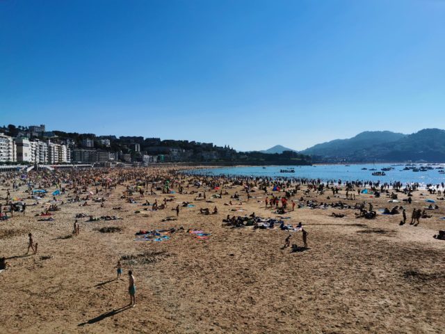 La Concha Beach on a sunny day draws large crowds