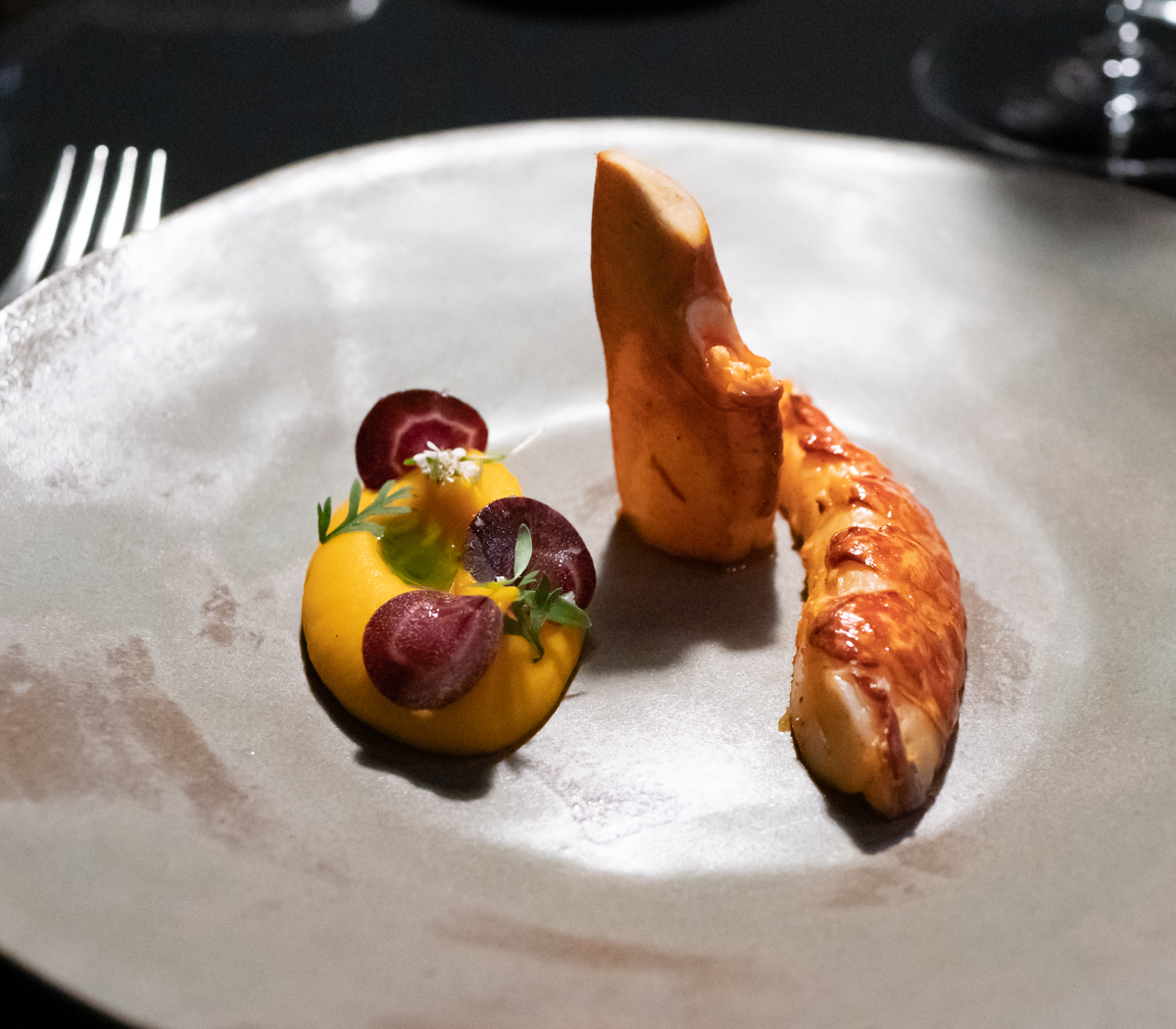 French blue lobster with Tandoori spices, carrot mousseline, Lampong pepper reduction with fresh coriander.
