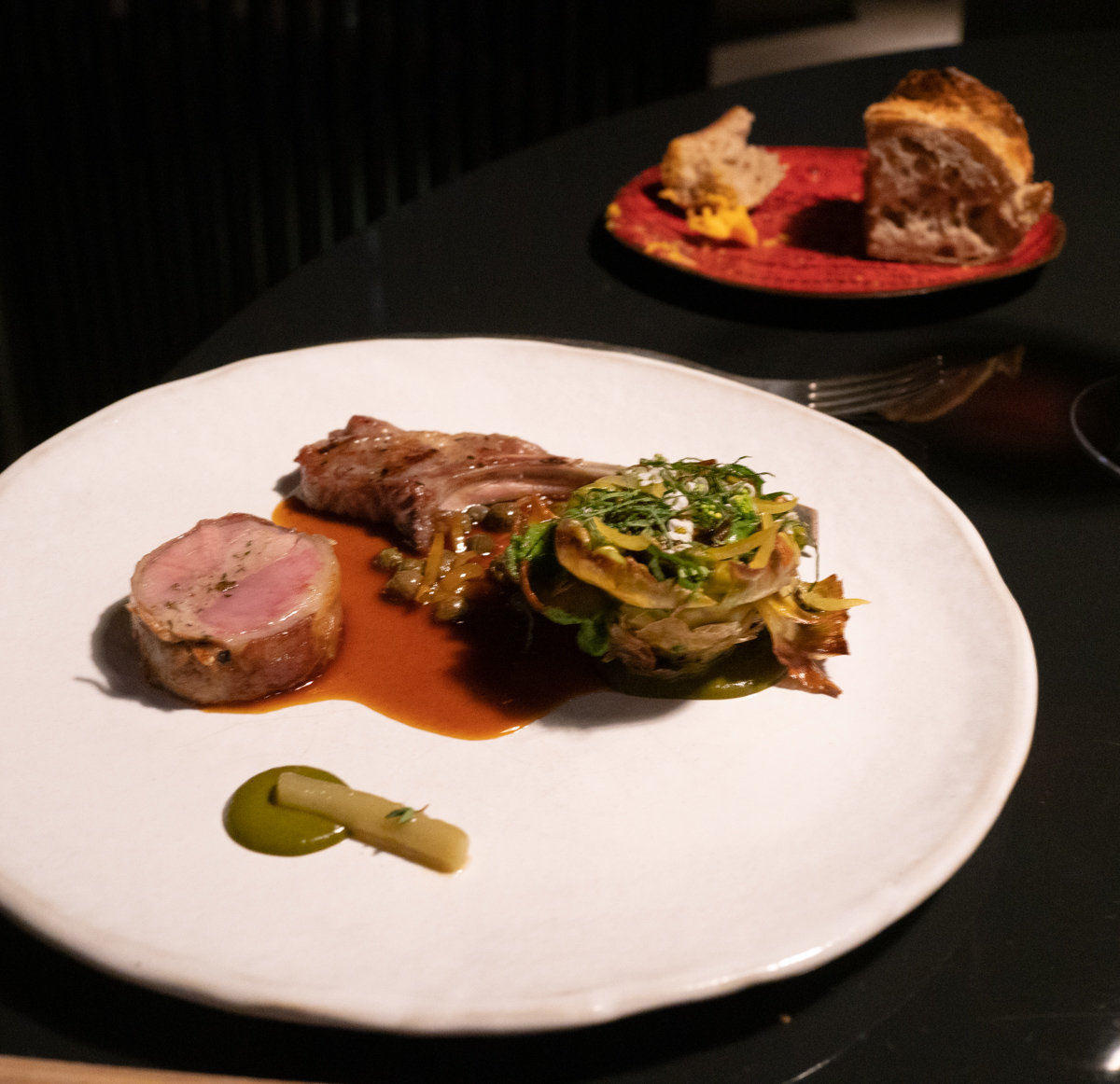 Bryan ordered the lamb as his entree, which came with two preparations: a seared lamb rib and a roulade.  On the side, a beautiful seared artichoke heart topped with a mint pesto